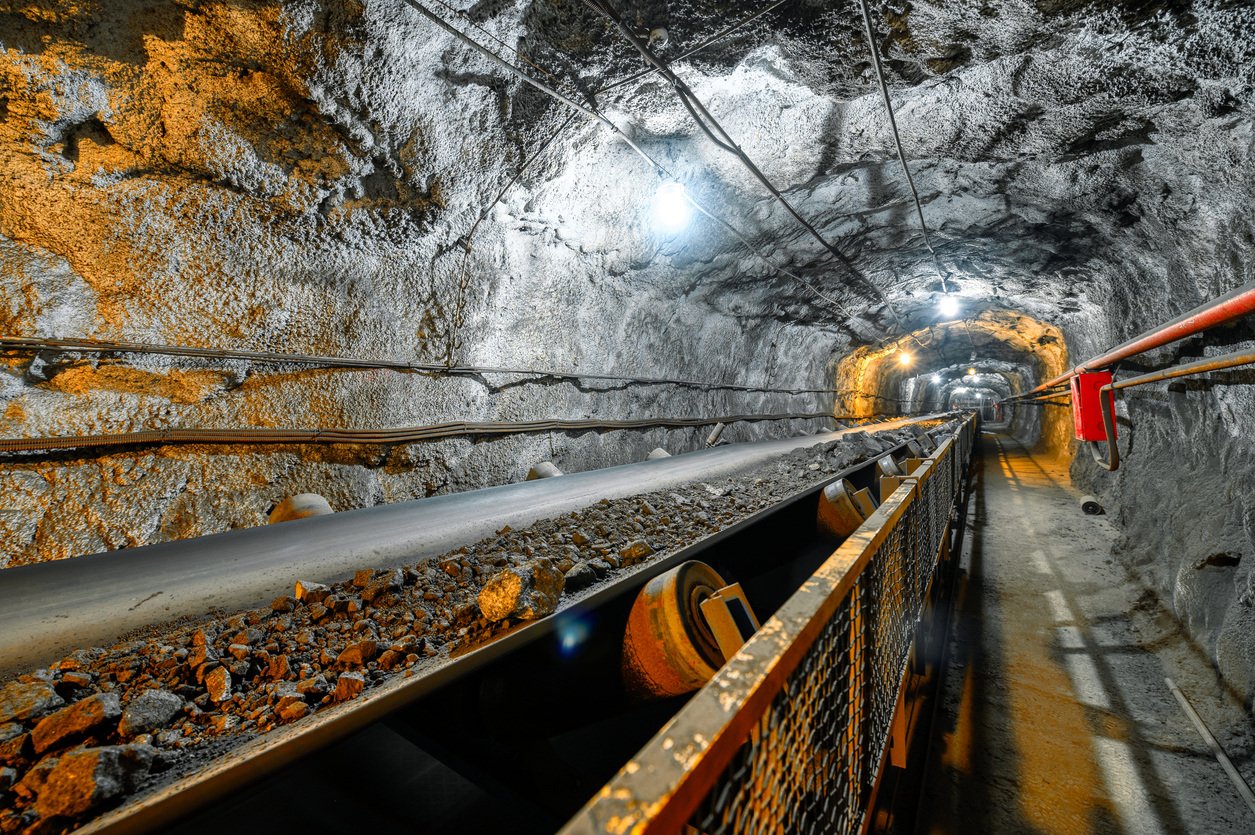 Belt conveyor in an underground tunnel transporting ore to the surface. SMD PCB Sensors keep people safe while working in mines